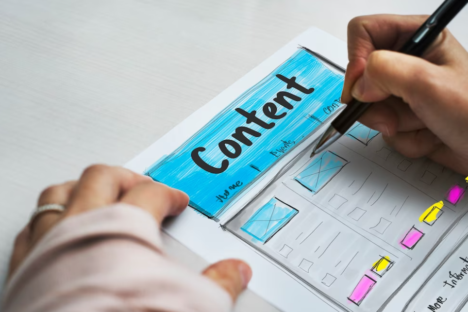 hands with pen on the colorful sheet with word content on it