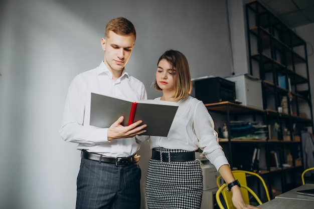 A guy and a girl reading a book